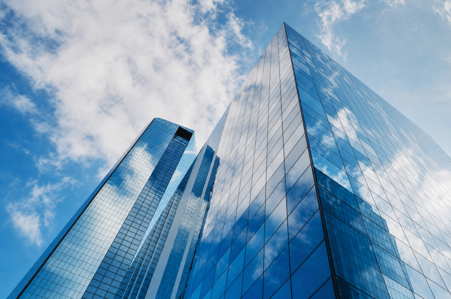 Financial district office towers representing the regulatory landscape for AI oversight